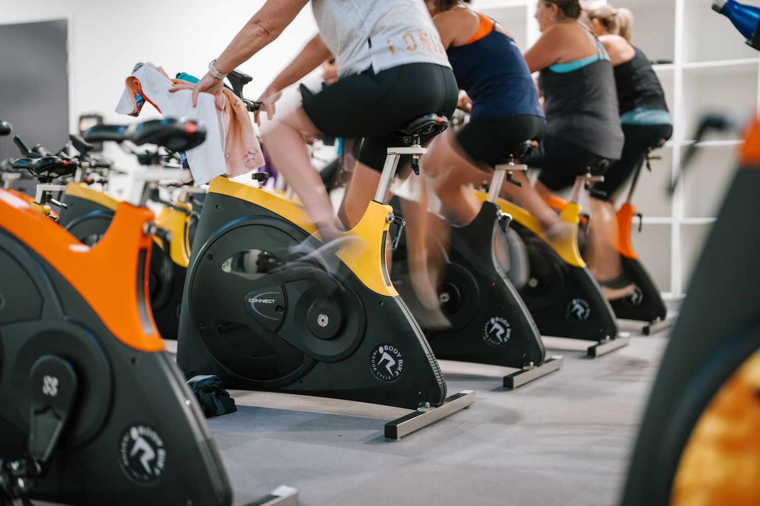 People on spin bikes at a group fitness class at the MARC